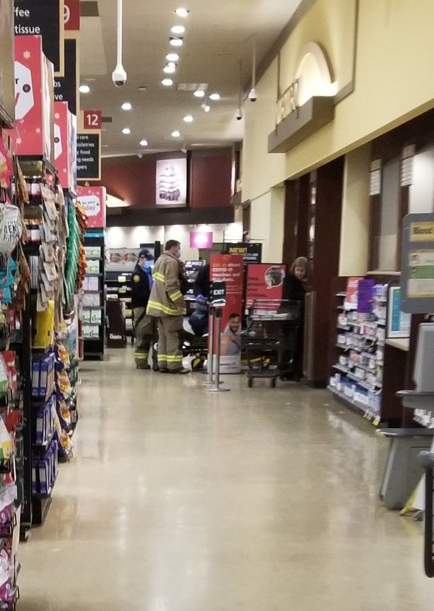 Not long ago I captured this while shopping. It was for an older man that just received his shot. He was laying on the ground when I walked by. People were still lining up.