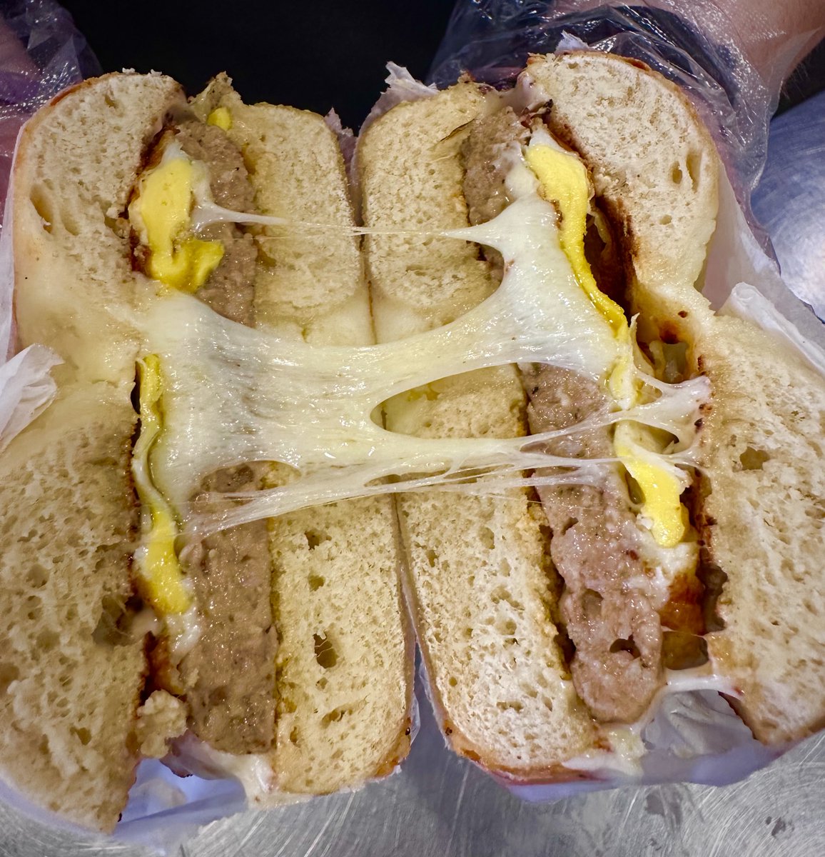 Get a load of that cheese pull! 🤤🧀 American, cheddar, gouda, and more! 

... 

#bbcbagel #bagel #bloomington #indianauniversity #iubloomington #iu #cheesey #cheesepull #localfoods #lunch #breakfast