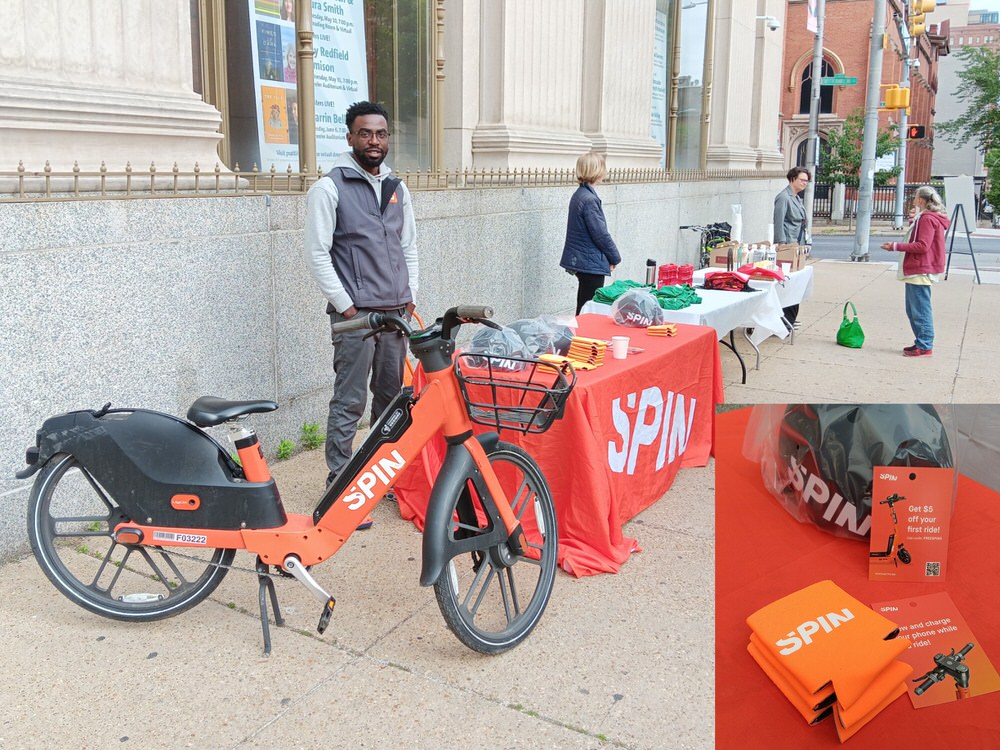 #biketoworkday2023 pit stop outside the Central Pratt Library on Cathedral Street this morning, until 10am. Free coffee and swag from <a href="/prattlibrary/">Pratt Library</a> as well as <a href="/ridespin/">Spin</a>