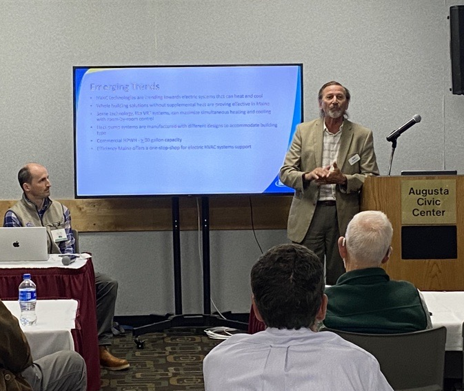 Efficiency Maine’s Commercial Program Manager Rick Meinking (right) discusses recent advancements in heating technology at the 2023 Summit on Maine's Economy &amp; Climate Change. Visit loom.ly/XyXDfG0 for information on current funding opportunities for Maine businesses.