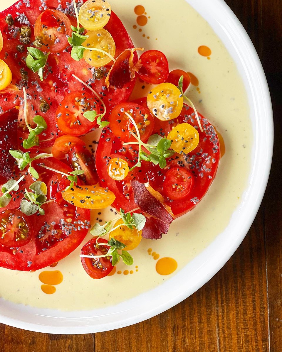 Tomato Salad with Tonnato Sauce, Crispy Prosciutto, Basil Seed Calamansi Vinaigrette and Calabrian Pepper. 
#theanvilpubandgrill #tomatosalad #summermenu