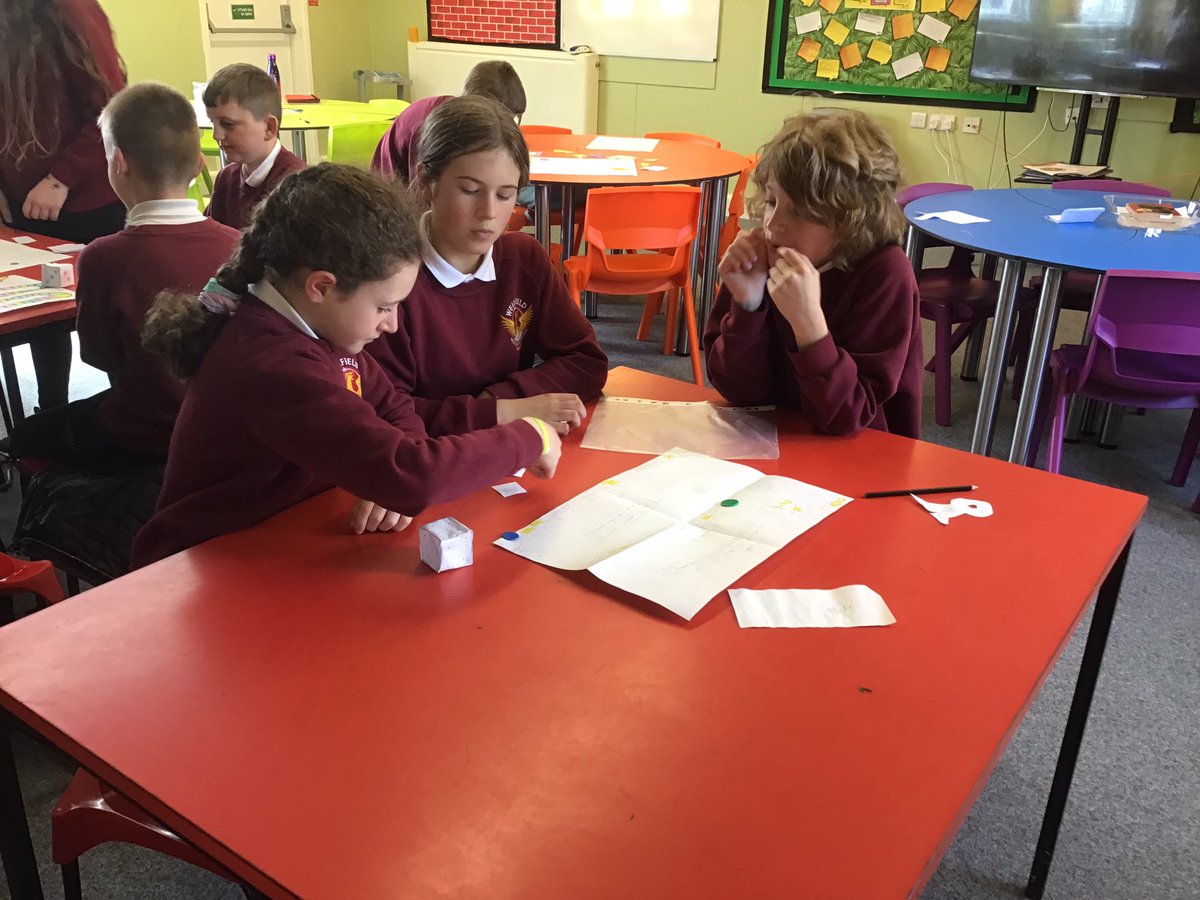 WellfieldMiddle's tweet photo. Year 6 have been working hard on their own mathematical board games recently. Today, they had fun teaching Y5 how to play them! Fantastic communication skills! #WMSMaths #WMS5Cs https://t.co/0XRA64xaji