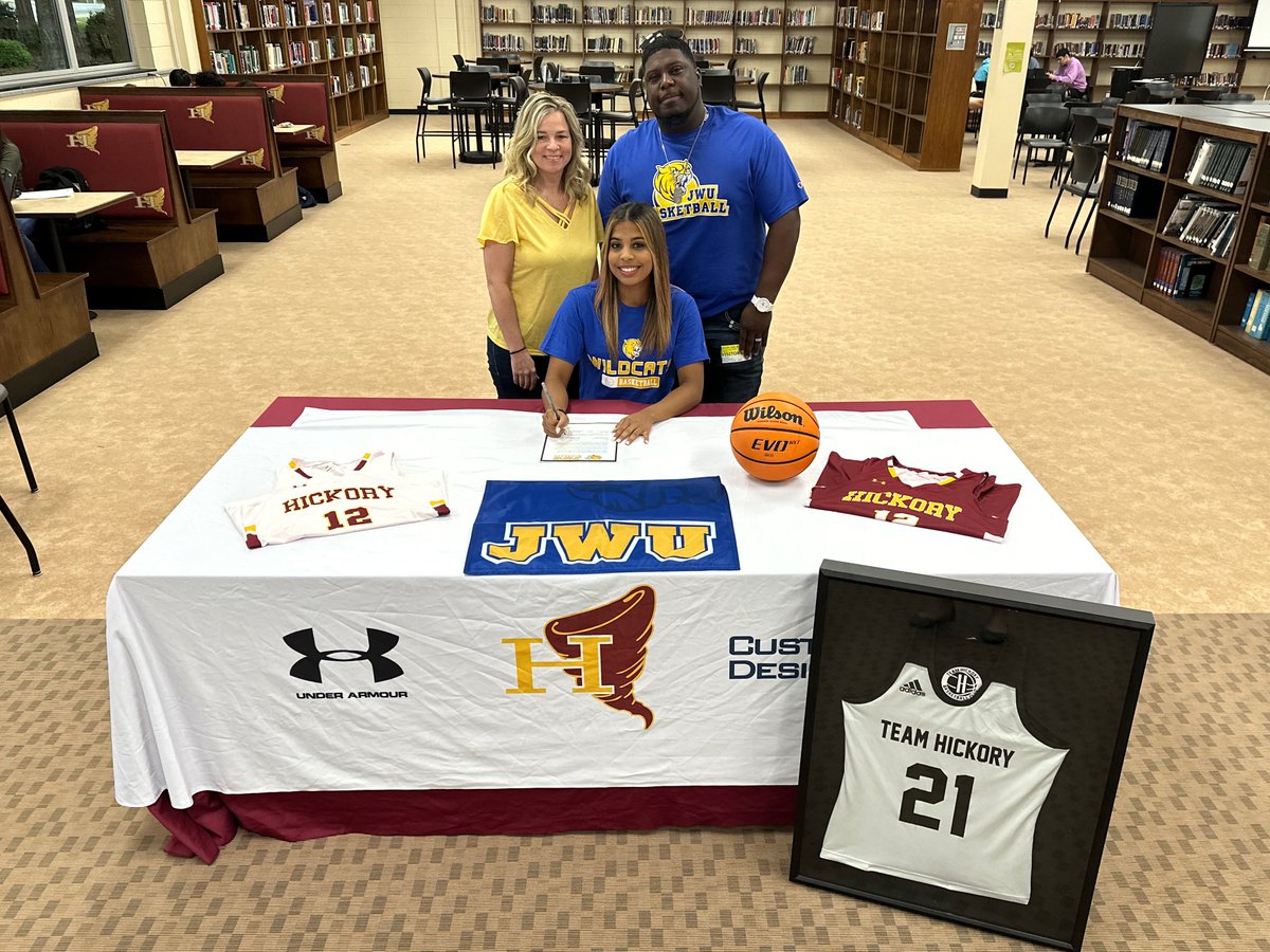 Hickory High senior Joselin Turner signed her national letter of intent on Friday to play basketball at Johnson &amp; Wales University after graduation. Pictured from left are her mother, Jeannie, Joselin, and her father, Randall. 🎓🏀
