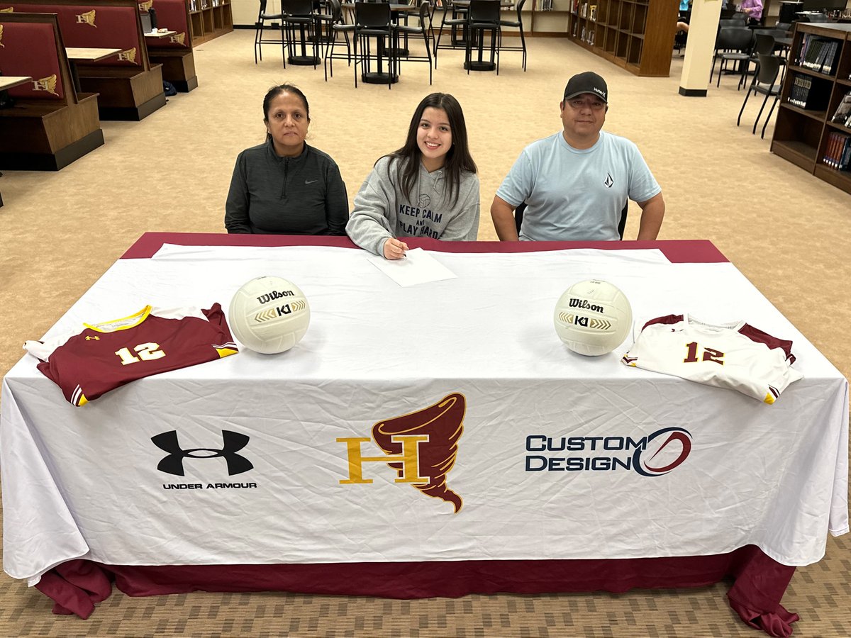 Hickory High senior Daniela Castillo Velasco signed her national letter of intent on Friday to play volleyball at Cleveland Community College after graduation. Pictured from left are her mother, Angela, Daniela, and her father, Luis. 🎓🏐