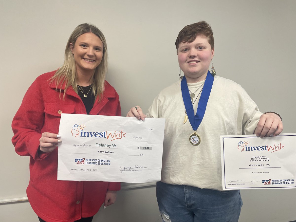 Congrats to Delaney Wusk on winning the Nebraska Council of Economic Education’s InvestWrite essay contest. Presenting Wusk with her $50, medal and certificate was Haley Baehr, Administrative Assoc. for the Council.  #ExcellenceEverywhere #GoWahooBlue ⁦<a href="/wahoopublic/">Wahoo Public Schools</a>⁩