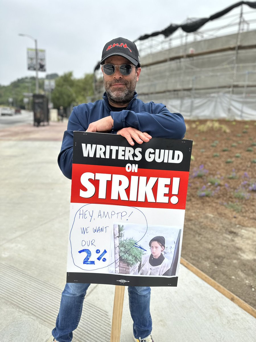 Decided to level-up my #WGAstrike sign game with a nod to an all-time classic. #betteroffdeadmovie #iwantmytwodollars #WGAStrong #UnionStrong #DoTheWriteThing