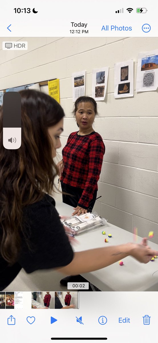 Ms. Squires learning how to play Gonggi at our AAPI Friday! So fun!!