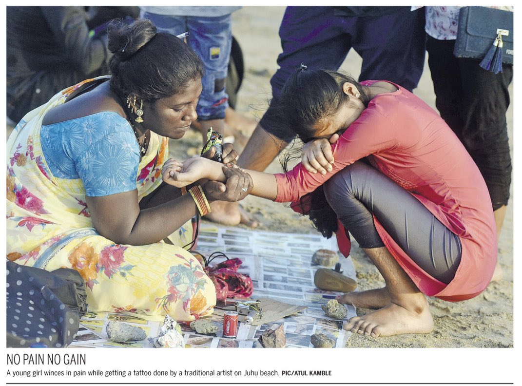 NO PAIN NO GAIN:
A young girl winces in pain while getting a #tattoo done by a traditional artist on #JuhuBeach. 

Photo: @iamATULKAMBLE for @mid_day