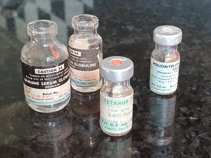 Tiny medical vials once used to store vaccines for polio & tetanus