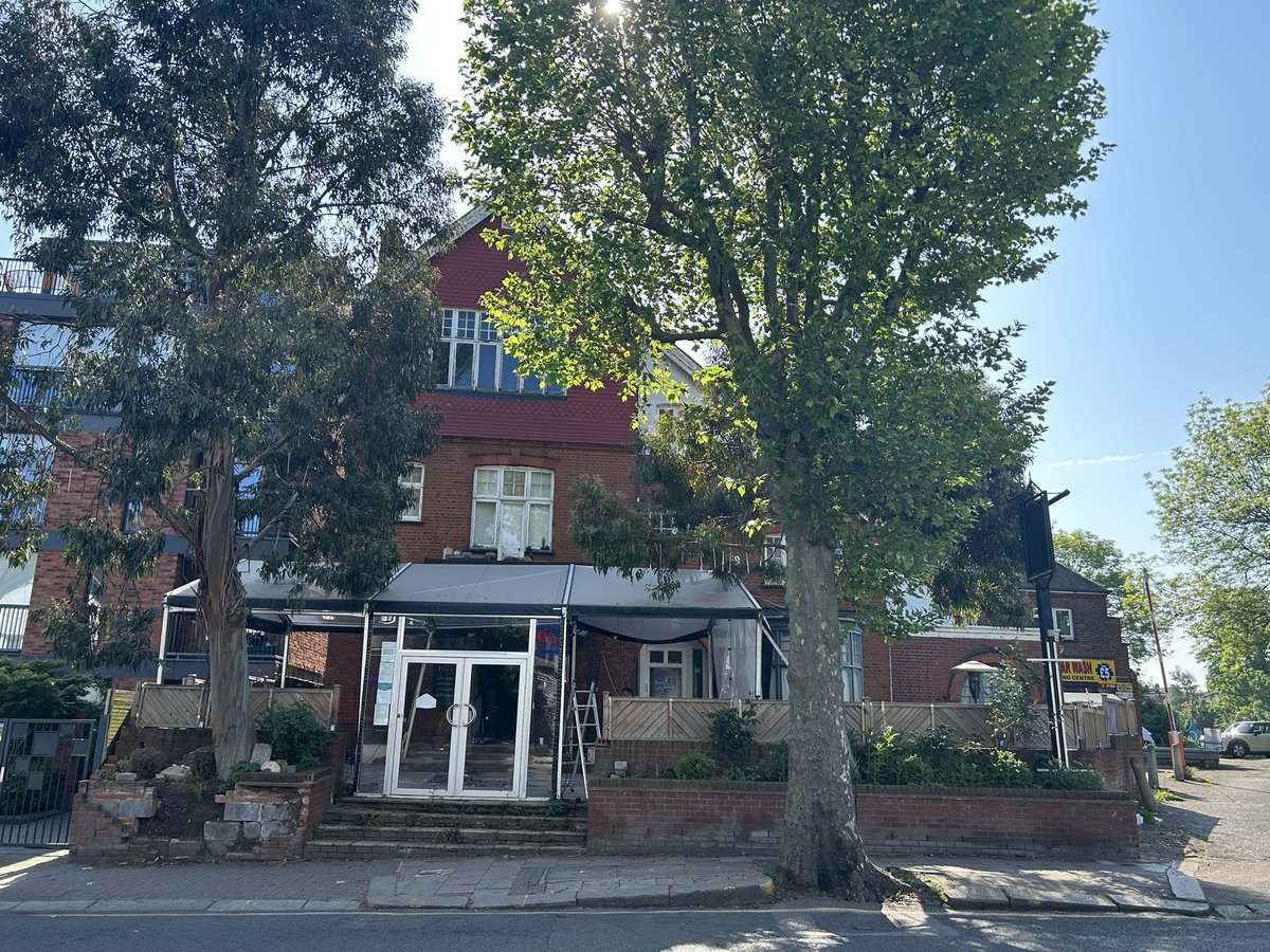 PubsSaving's tweet photo. Builders in The Queensbury #pub #willesdengreen this morning and looks like scaffolding is going up outside the building. Could demolition of this much loved community pub be imminent? Planning permission was granted for redevelopment back in 2019. ๐ข. #pubsmatter https://t.co/TtnqYoS77X