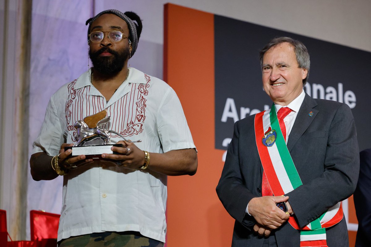 la_Biennale's tweet photo. #BiennaleArchitettura2023 #TheLaboratoryOfTheFuture Silver Lion for a Promising Young Participant to @OJeyifous “for a multimedia installation that explores a worldbuilding practice that expands public perspectives, offering visions of a decolonised, decarbonised future”. https://t.co/DoWKYgr0Pb
