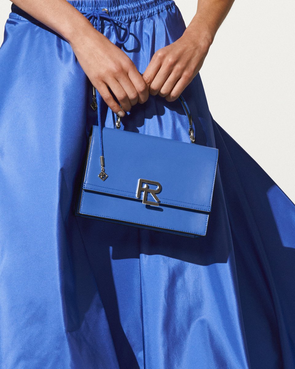In a play of texture and shape, Ralph Lauren’s cropped #PoloShirt is worn with a sea blue ballgown skirt that falls into a silk taffeta train.

Explore more from the #RLCollection Summer 2023 Capsule: rlauren.co/SummerBrights-T