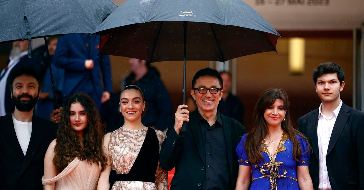 Reuters's tweet photo. Soggy Cannes premiere for Turkish director Ceylan's 'About Dry Grasses' https://t.co/5acPXD6DJj https://t.co/g2fBCQPLBI