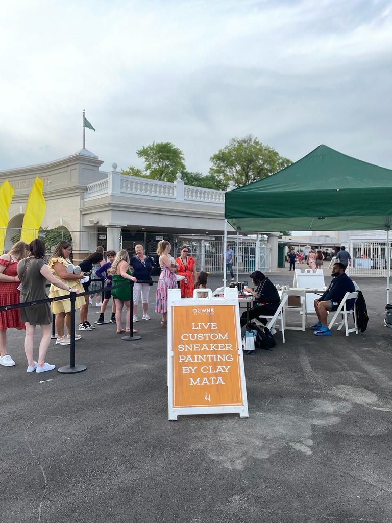 playwithclay's tweet photo. In action!! Thank you @ChurchillDowns for this opportunity #livecustom #sneakerpainting #art #churchilldowns #handpainted #sneakers https://t.co/FrKTrsG0Xm