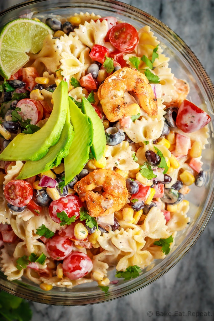 This Mexican pasta salad with Cajun shrimp is perfect for summer – easy to make, the whole family will love it, and it can even be made ahead of time! #ad Get the recipe: bake-eat-repeat.com/mexican-pasta-…