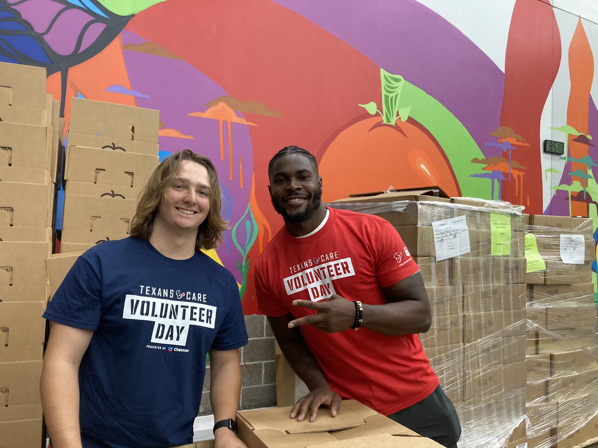Cooper and Jimmie Ward working hard at the Houston Food Bank! #TexansCare