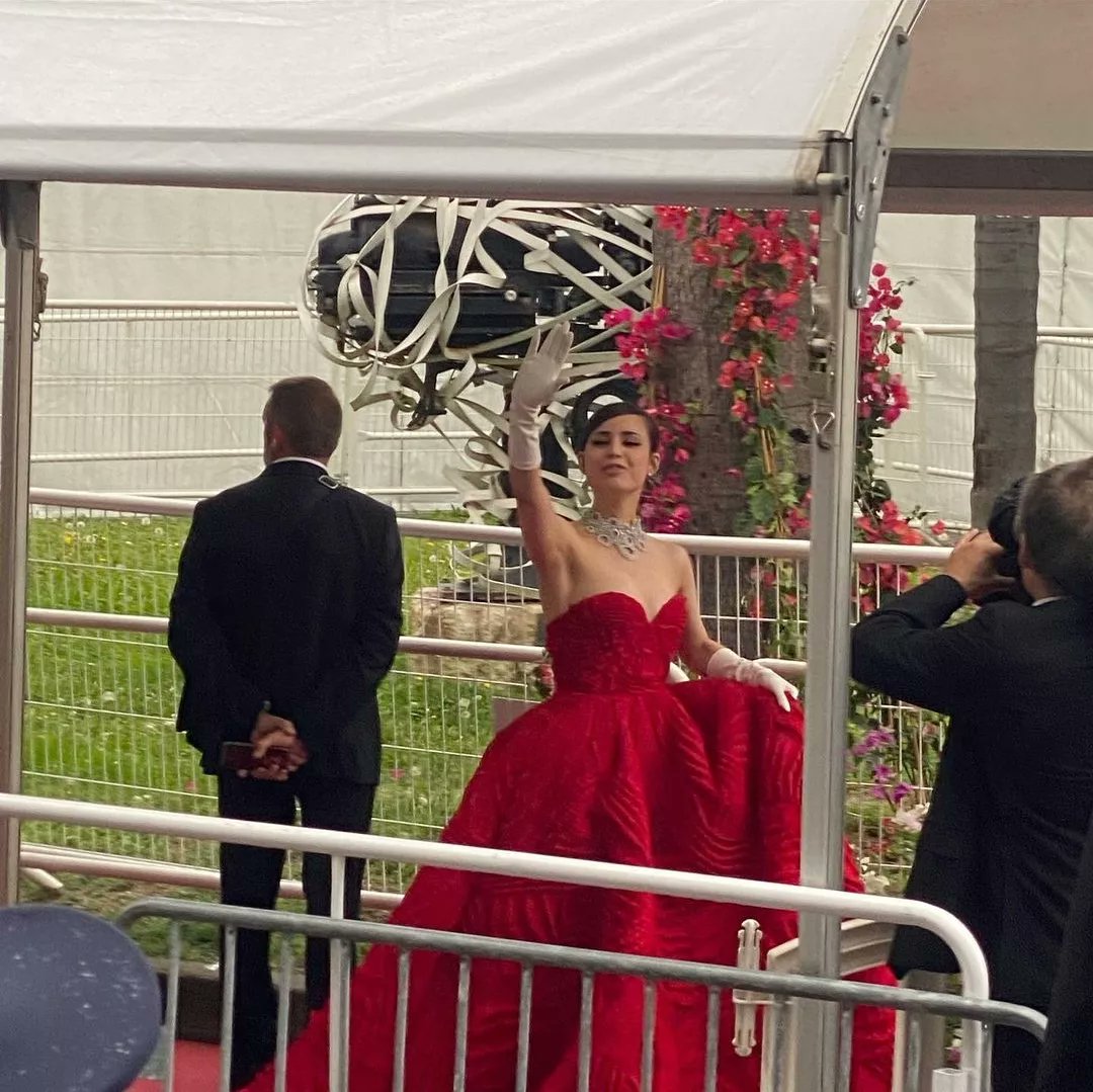 .<a href="/SofiaCarson/">Sofia Carson</a> waves to fans at the Cannes Film Festival