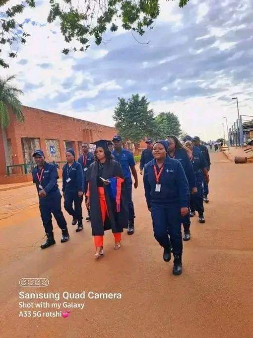 Security guards accompanying their colleague to graduation at University of Venda. She registered for a degree while working as a security. Education is expensive in order to prevent Blacks from excelling . #EFFMustRise

NB: Search for job opportunities at search67.com