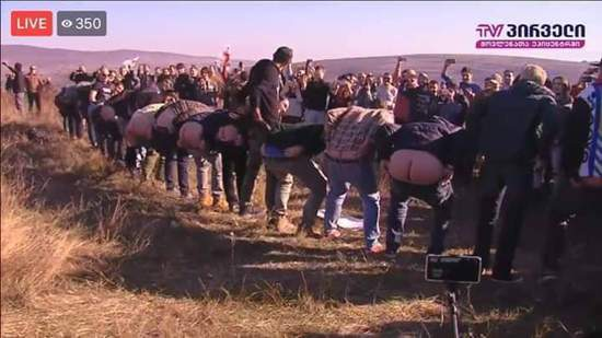 crazygeopol's tweet photo. Members of the libertarian Girchi party showing their blank buttocks to Russians close to the Tskhinvali occupation line (2018). https://t.co/LqgJ0tiTtX