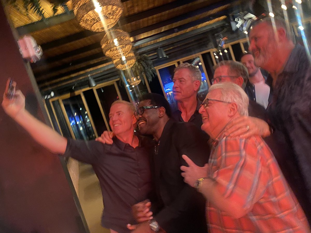 michaelirvin88's tweet photo. You can tell we played in the 90’s because we still don’t know how to take selfies!!! 😂😂😂😂……But we knew how to WIN SUPER BOWLS!!! 🏆🏆🏆. This was our OC retirement party. Thank you Norv Turner for reaching down inside our KIDS and pulling out our KINGS. WE LOVE YA COACH https://t.co/bYt0oByYww