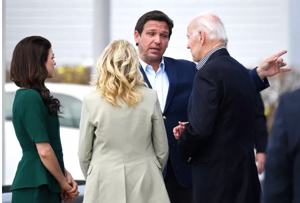 denike's tweet photo. @KeithOlbermann Biden is 6 feet tall and DeSantis claims to be 6'2". This is a meeting after Hurricane Ian attacked Florida. The questions: Is DeSantis wearing "higher" heels in this photo or normal shoes with no "lifts"? What is DeSantis's actual height? Why is he lying about it? https://t.co/3fbxOz4pLe