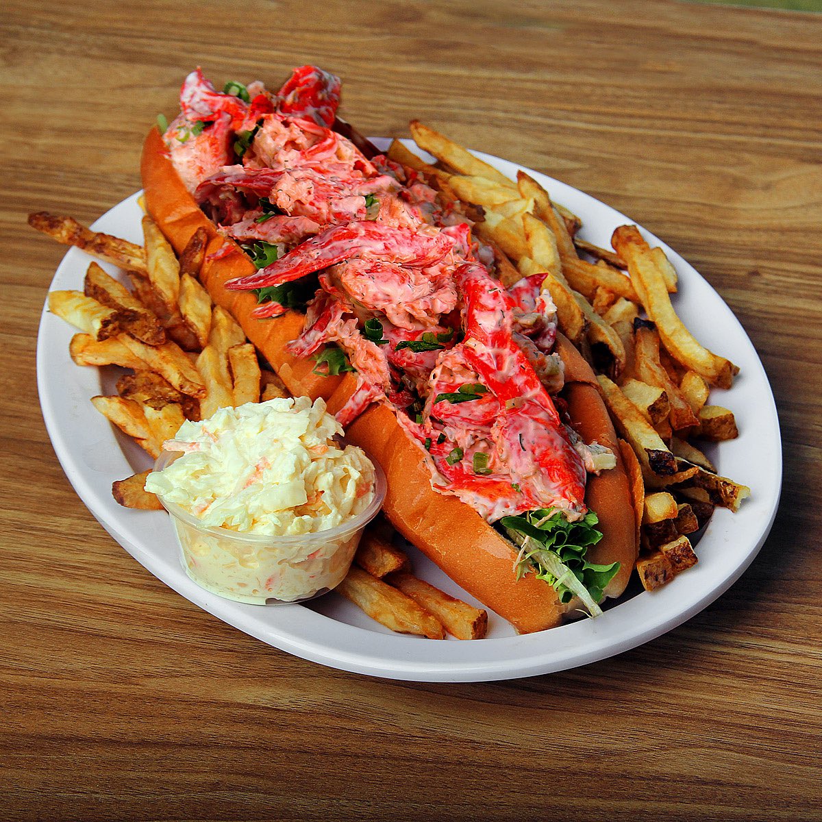 Tim_Banks's tweet photo. Our one pound, foot long “Lester” is on sale for $71 with hand cut fries and slaw… if anyone can eat it “all by themselves” within 12 minutes they get to pick out their free @blackbushpei tee shirt and their picture goes up on our achievement wall #lesterchallenge https://t.co/Ys38XpgXiU