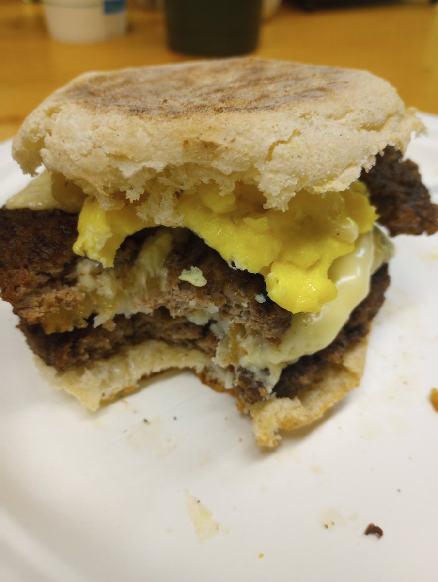 Leftover hamburger Patty's and scrambled eggs on an English muffin. 
#breakfastsandwich