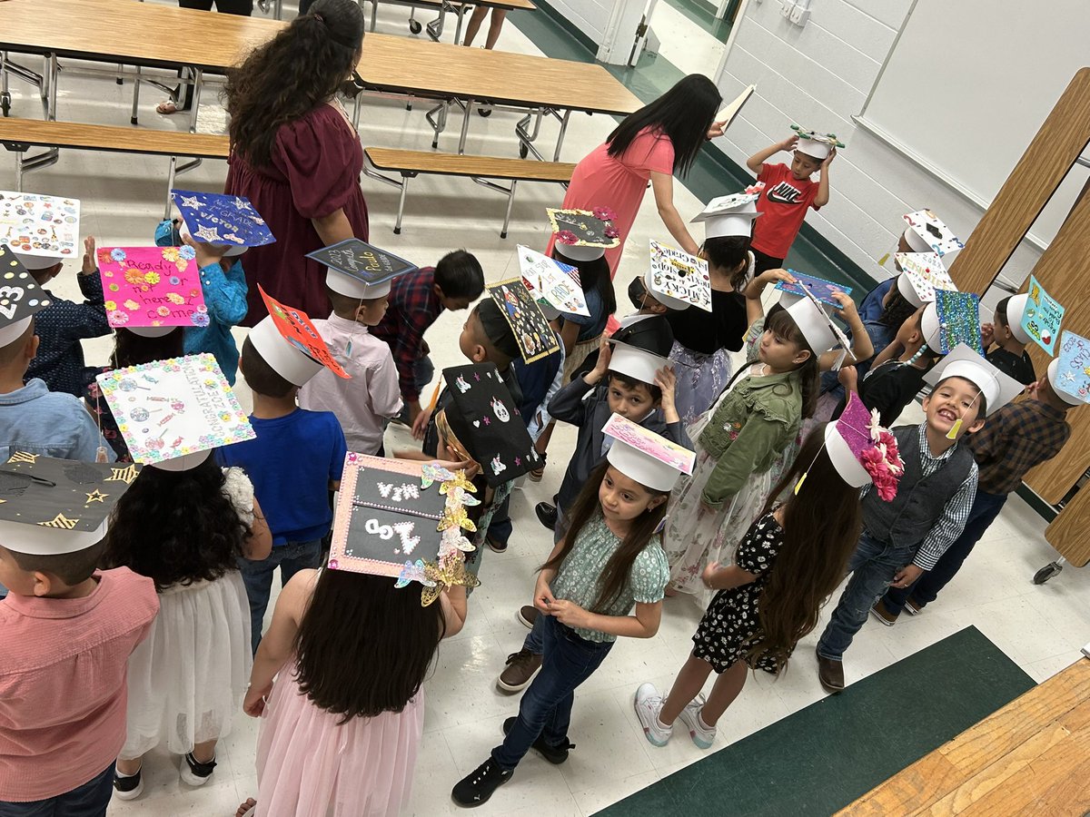 Kindergarten graduation! Loving their caps!
