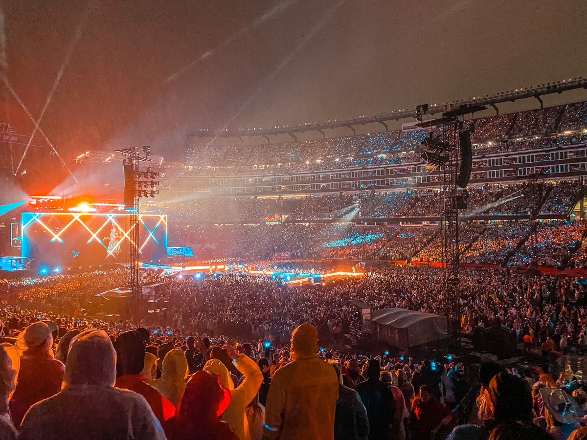 kateeeblack's tweet photo. The rainiest of rain shows and we danced our faces off. Literally! 🌧️ what an incredible show 🫶🏼 thank you @taylorswift13 @taylornation13 for the best night ever and babies first concert. #TSErasTourFoxborough #TheErasTourFoxborough #TSTheErasTour  @GilletteStadium https://t.co/8VXchLokUn