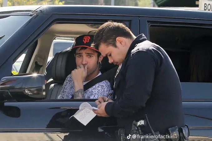 favorite pete wentz photo: him getting a ticket