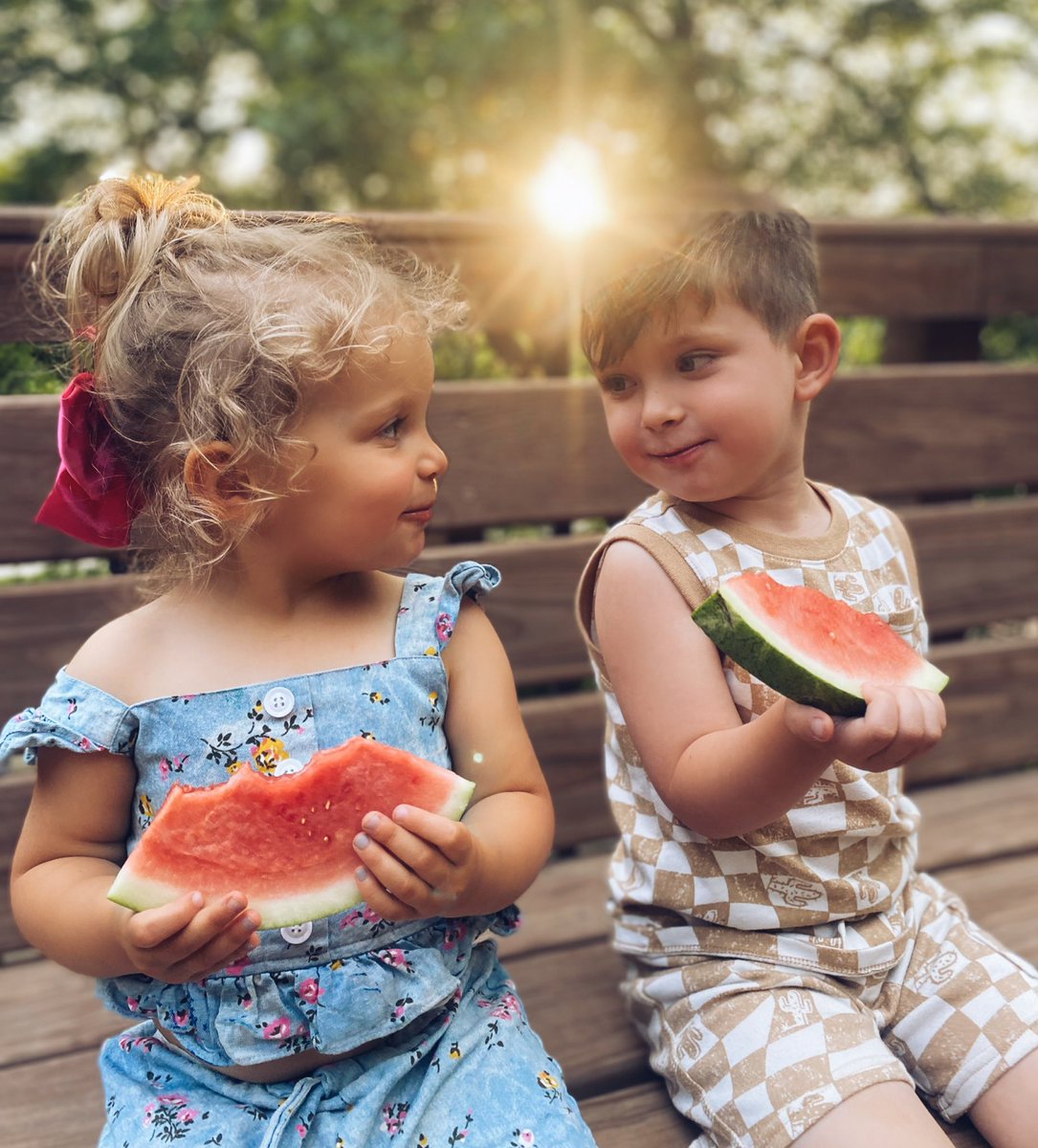 I take over 2000 photos a week. For the last 7 years. This was shot with my iPhone 11- and I have to say it’s one of the top ten photos I’ve ever taken. It’s even a real sun flare. Lol! 🤣 These two ❤️🍉.  #omahaphotographer #family #love