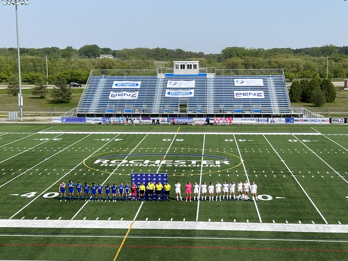 EqualTimeSoccer's tweet photo. ROCHESTER ROAD TRIP REPORT

@RochesterClub has its first ever @USLWLeague home opener today! They dropped a close one to @BavarianSoccer 0-1. 

Here’s our report:
- Rochester started in a 4-2-3-1
- Bavarians started in a 4-2-2-2
- Rochester was a bit scattered to start, but that’s somewhat expected for a team only now getting it’s players. 
- Bavarians also came out passing and combining really well. Scored in the 10th minute on what would be the game winner. 
- Rochester had a player go down with an injury a few minutes later and, after a break for her to be treated/helped off, they actually had — at minimum — equal run of play for the bulk of the middle of the game
- Bavarians largely took the reigns back toward the end of the game other than a late game flurry of chances for Rochester in the last few minutes like the *unreal* free kick by @Lissamizutani that had to be saved (video bottom right)
- both teams probably could have gone to their benches earlier. Reminder, in the W League, there is no reentry. BUT there are 7 subs allowed. So you basically *have* to sub a couple at half, a couple at min 60 etc to get the full use of your bench. 
- Fun @GopherSoccer tie in: Katie Koker (Racine native) is on this team but so is Eva Bruer! Both are deep cuts for casual fans but jumped out to us right away 
- Top players for Rochester were probably Mizzutani, Birch, DeGannes, and FOR SURE @arecarte844 in the attack and @cocoalcalde1 in goal, who might have no joke saved 3-5 goals with her shot-stopping. Chelsea Brown and Jayda Brown also added some really good energy and spark in a game that was a bit of a tough slog in 80 degree full sun with plenty of players clearly working into shape. 
- stadium notes: great playing surface, big stadium, concessions and merch available, nice gameday presentation overall 
- Also, don’t look now but @BavarianSoccer stocked up 6 points in their first two games. Plenty of season left but hard for Bavs to feel anything but psyched about that kind of opening weekend.