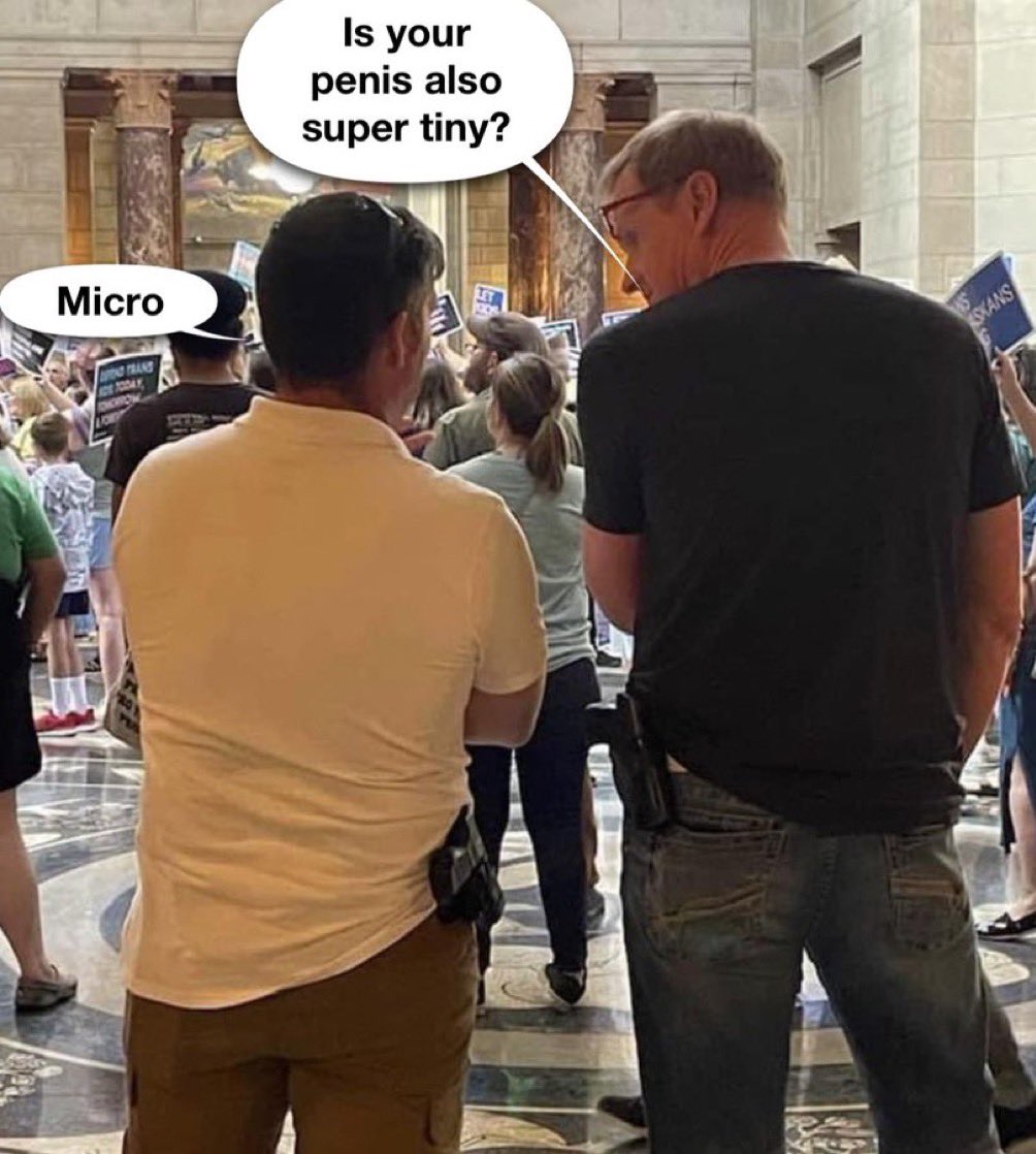 Seen here, on the right, is @KirkPenner, a member of the State Board of Education. Kirk felt it appropriate to openly carry a firearm in the Capital while trans advocates engaged in peaceful demonstrations on #LB574. Kirk’s definitely an “Alpha” male, huh?

#SadLittleMan 🖕🏻🫵🏻