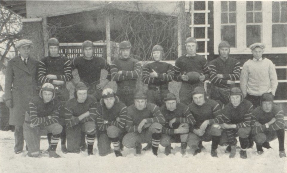 Pose in the snow. No problem. These 1926 Ainsworth Bulldogs were so tough that they got into an argument about who would GET TO kneel in the white stuff.