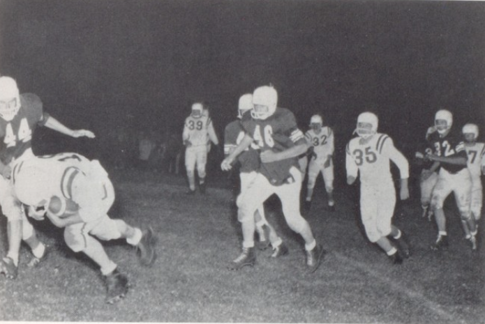 The Ainsworth eleven pushes the ball forward in a 1958 game with Stuart.