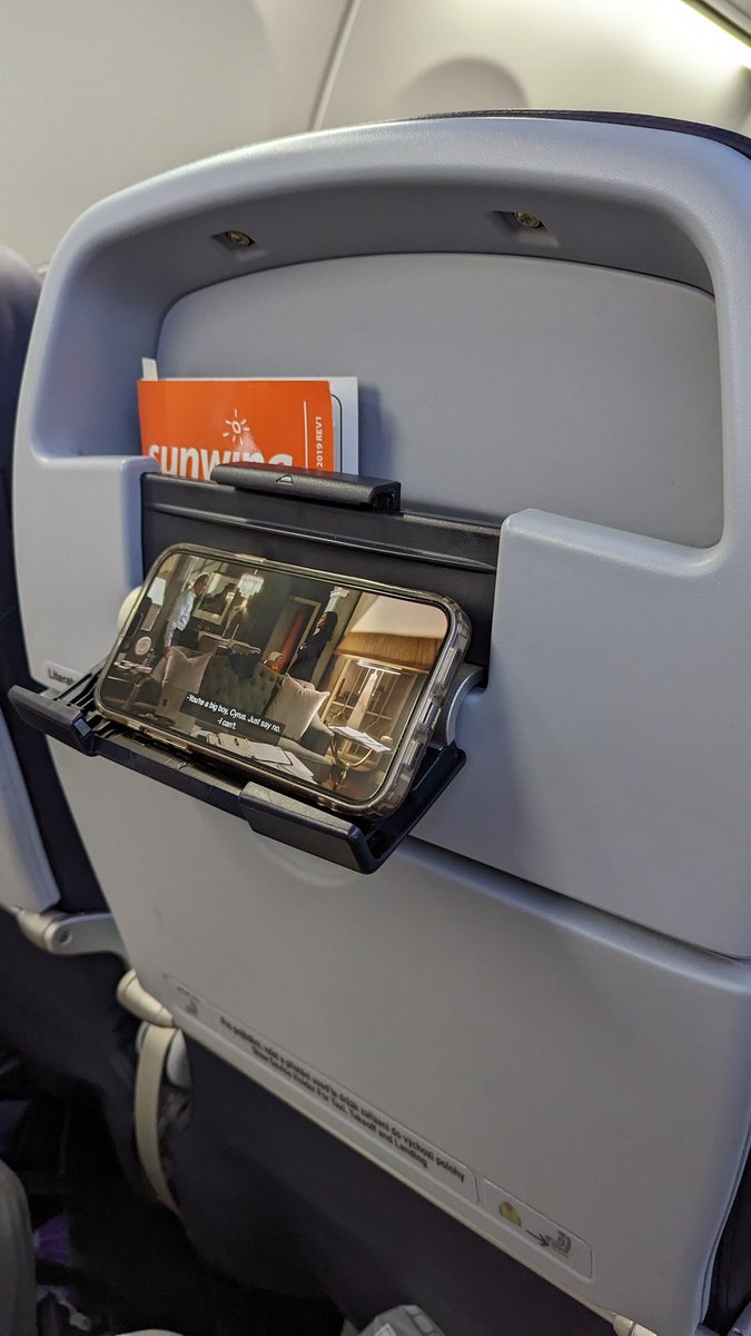 Sunwing has installed these phone holders on their plane. They got rid of every other service like offering complimentary champagne and soft drinks though. One step forward, two steps back.