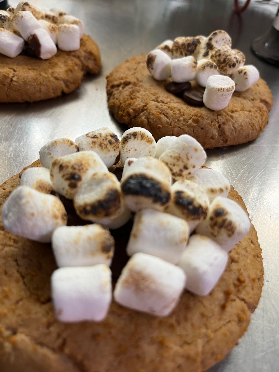 AwuCafe's tweet photo. Starting S’mores week with a s’mores cookie. Chewy, buttery graham cracker cookie topped with chocolate and marshmallows lightly toasted. Pair it with our s’mores premium mocha. We have blueberry or chocolate chip scones and raspberry cheesecake rolls today as well. https://t.co/DebElzAez0