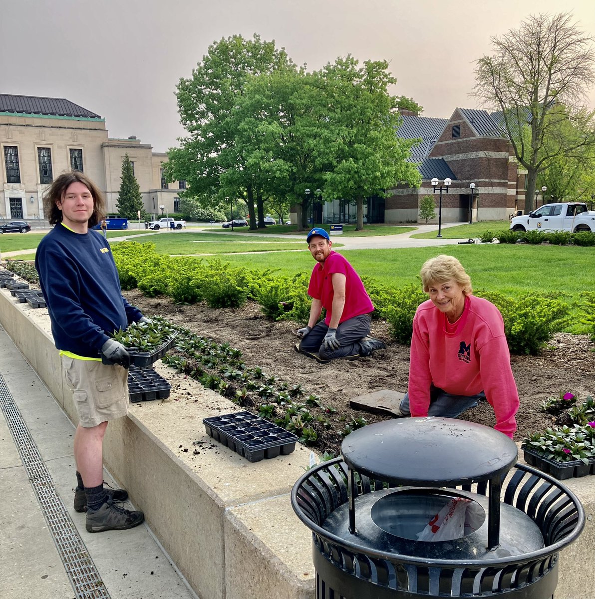 Here's part of the "We Make Blue Go!" team, planting Ingalls Mall for summer. We'll all be enjoying their work shortly! 🌺#umichgroundsservices #umichcampus