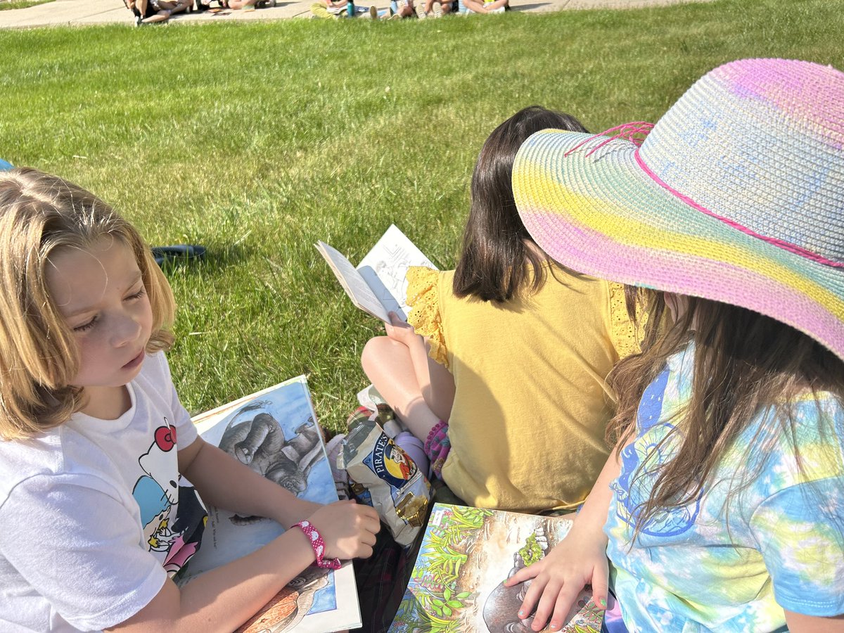 Enjoying the beautiful weather on Outside Day with some silent reading time.