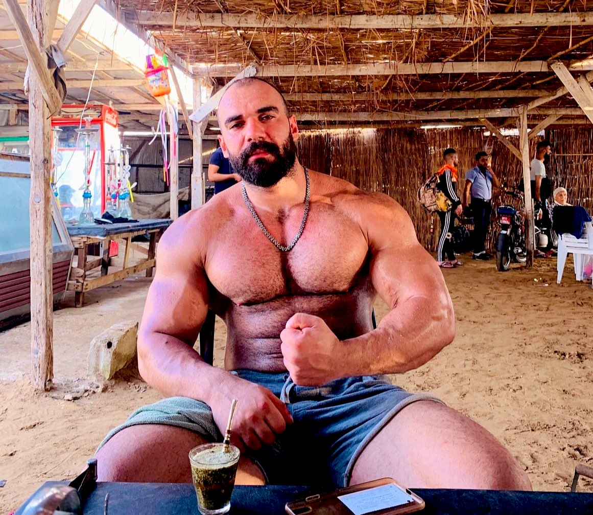 Hot bearded syrian bodybuilder beast displaying his massive bulging muscles. Amazing pecs, huge biceps, chiseled abs & hot quads. #MUSCLEGOD #musclehunk #hotbeard #muscleworship #menarehot #hunkofheday #menarehot #pecs #hairymuscles