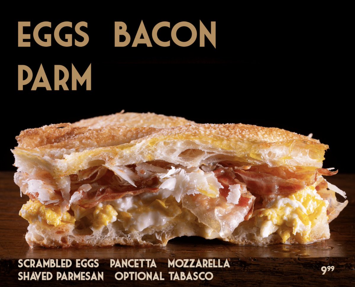 Eggs Bacon Parm: The next best thing to waking up in Tuscany! Indulge in the perfect harmony of scrambled eggs, crispy pancetta, melted mozzarella, and shaved parmesan. It's breakfast bliss on a whole new level! #nycbreakfast #nyc #bryantpark #unionsquare