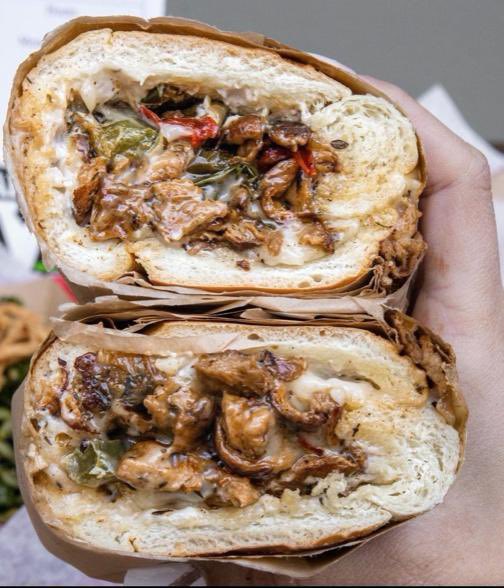 Cajun Cheezy Peppersteak. 
Warm your mouth with some Cajun heat from the south. Marinated spicy soy curls, sautéed onions, grilled green &amp; red peppers, #vegan mozzarella, stuffed into a fresh hero roll. Drizzled with house made blue cheeze. Can be made GF.