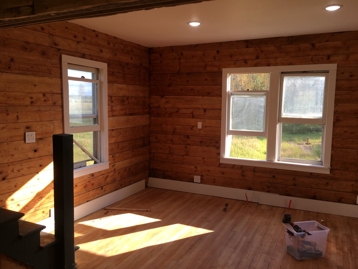 alexmaxwrites's tweet photo. It took months of sanding to get the ship-lap to the glowing first picture. The boards I'm pointing to in the third picture took an hour to clean up. Whatever cardboard backing or glue was used before the wallpaper went up did not want to come off. https://t.co/zKGWlPONAg