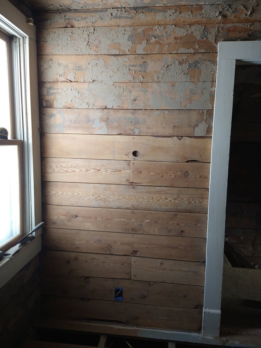 alexmaxwrites's tweet photo. It took months of sanding to get the ship-lap to the glowing first picture. The boards I'm pointing to in the third picture took an hour to clean up. Whatever cardboard backing or glue was used before the wallpaper went up did not want to come off. https://t.co/zKGWlPONAg