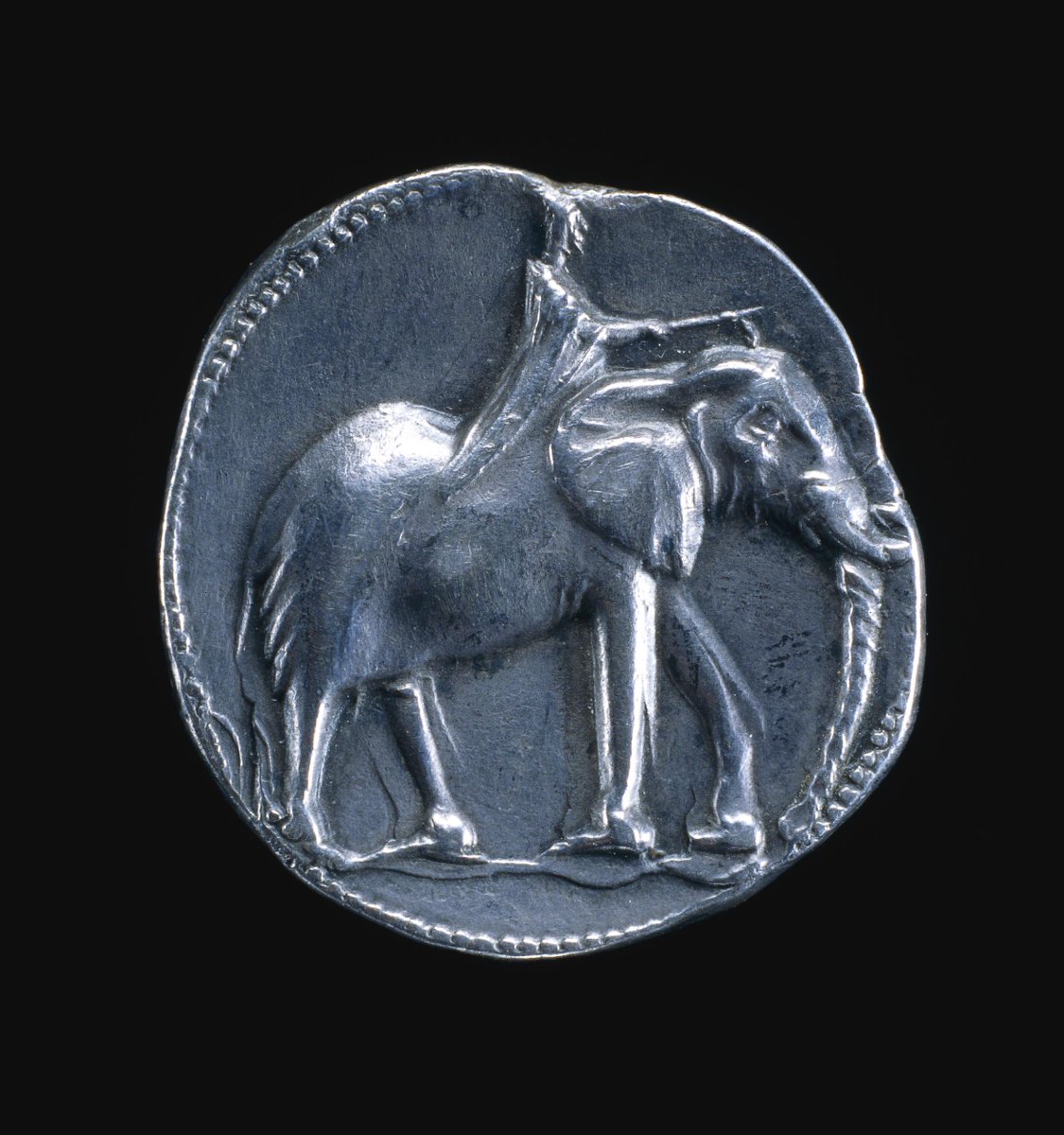 This Carthaginian coin held by the British Museum depicts Melquart, Punic King of the Underworld, and Hannibal upon an elephant. Minted in Spain 227-209BCE, it's possible that this was a commemorative coin of Hannibal's march across the Alps, narrowing the mint date to 218-209BCE