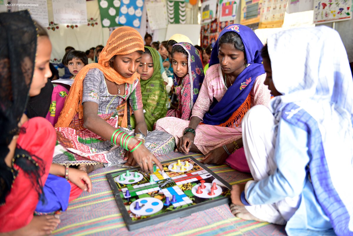 UNICEF_Pakistan's tweet photo. Play improves the cognitive, physical, social, and emotional wellbeing of children and young people. These young girls at a #ChildFriendlySpace in Umerkot, Sindh play #Ludo, a fun, competitive game that requires strategic thinking in order to win. https://t.co/Y1uAAGt7yQ