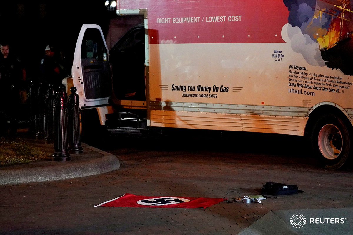 A Nazi flag and other objects recovered from a rented box truck lie on the ground as the U.S. Secret Service investigate the truck that crashed into security barriers at Lafayette Park across from the White House in Washington. REUTERS/Nathan Howard ⁦@SmileItsNathan⁩