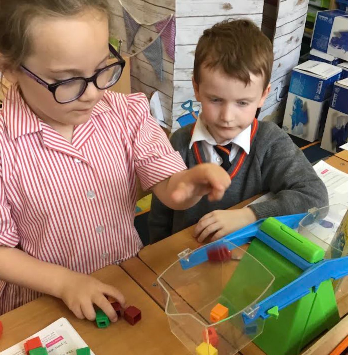 SJC_Infants's tweet photo. The children in #SJCR6 have been using the balance scales to weigh items. They used the measuring cubes to balance the scales. #SJCMathematics #SJCInfants https://t.co/YVcHGFPl2S