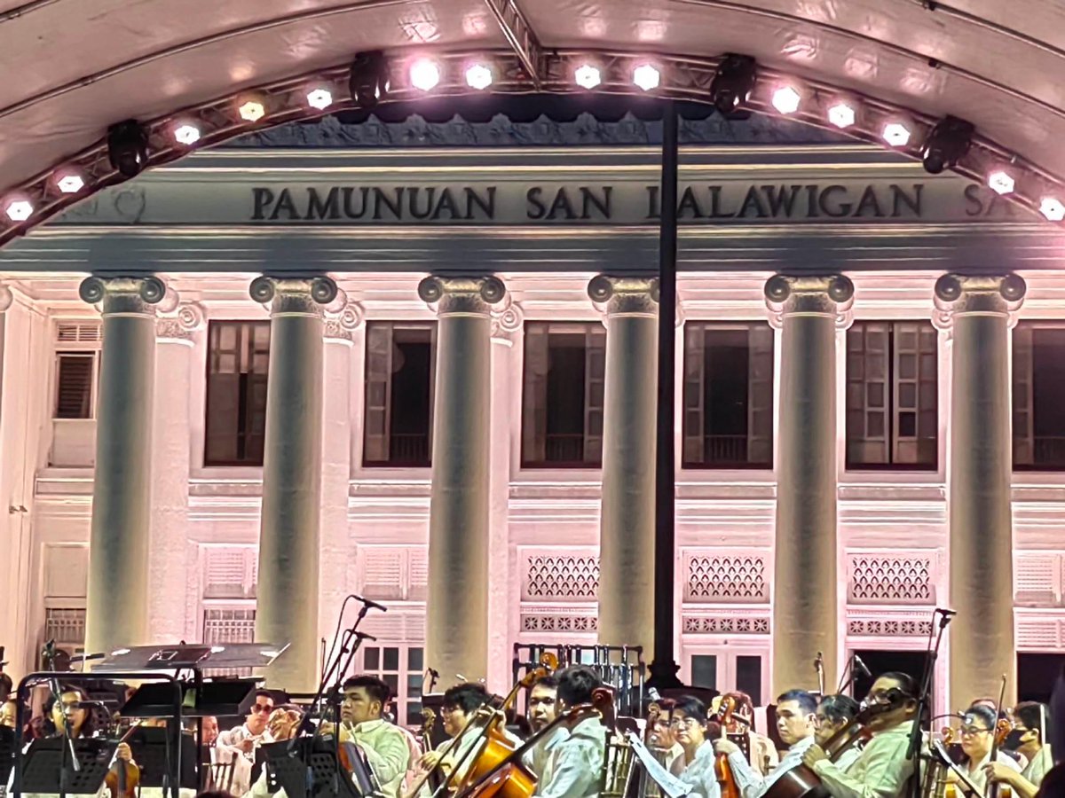 The University of the Philippines Symphony Orchestra plays at the historic Leyte Capitol. This colonial building served as the main office of the Philippine Commonwealth after American troops returned in 1944.