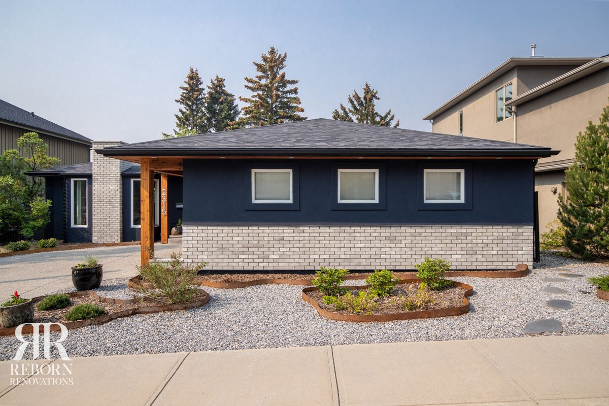 RenosReborn's tweet photo. BRIAR HILL // Check out the before and after on this exterior renovation! Here in Briar Hill we replaced old grey stucco and rough stone with a new dark blue colour palette, light brick work  and a pop of colour in the wooden accents.
https://t.co/eG91X7UKSO
#exterior #renovation https://t.co/xX5jmS2jxp
